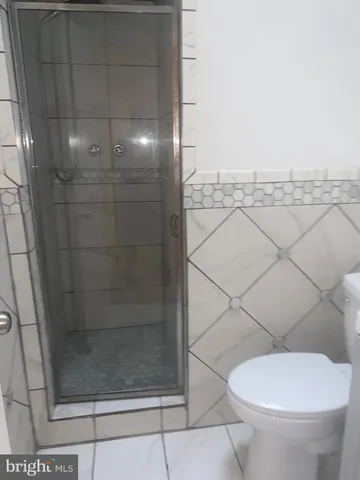 an empty room with wooden floor