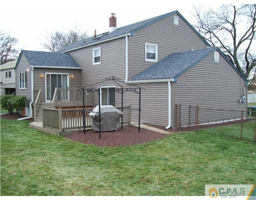 8 Phillips Road Edison, NJ 08817 - Photo 3 of 25 a front view of house with a garden and deck