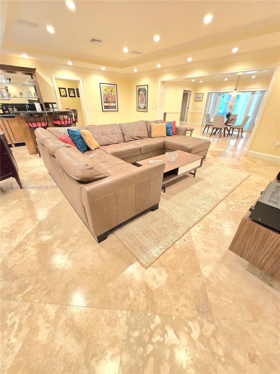 7895 Southwest 122nd Street Pinecrest, FL 33156 - Photo 14 of 78 a living room with furniture and a flat screen tv