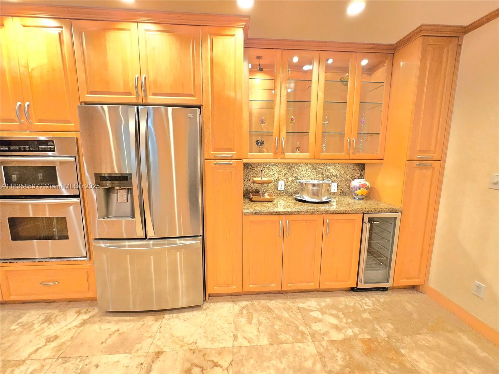 7895 Southwest 122nd Street Pinecrest, FL 33156 - Photo 33 of 78 a view of a refrigerator in kitchen and a window