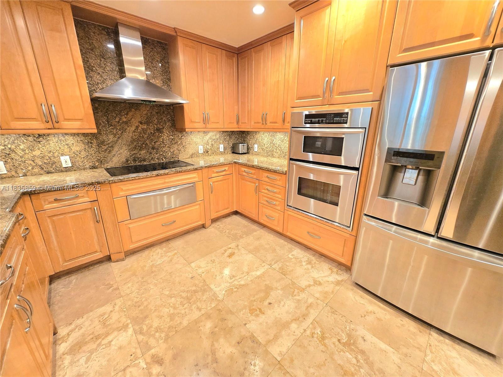 7895 Southwest 122nd Street Pinecrest, FL 33156 - Photo 34 of 78 a kitchen with stainless steel appliances granite countertop a refrigerator a stove and a sink