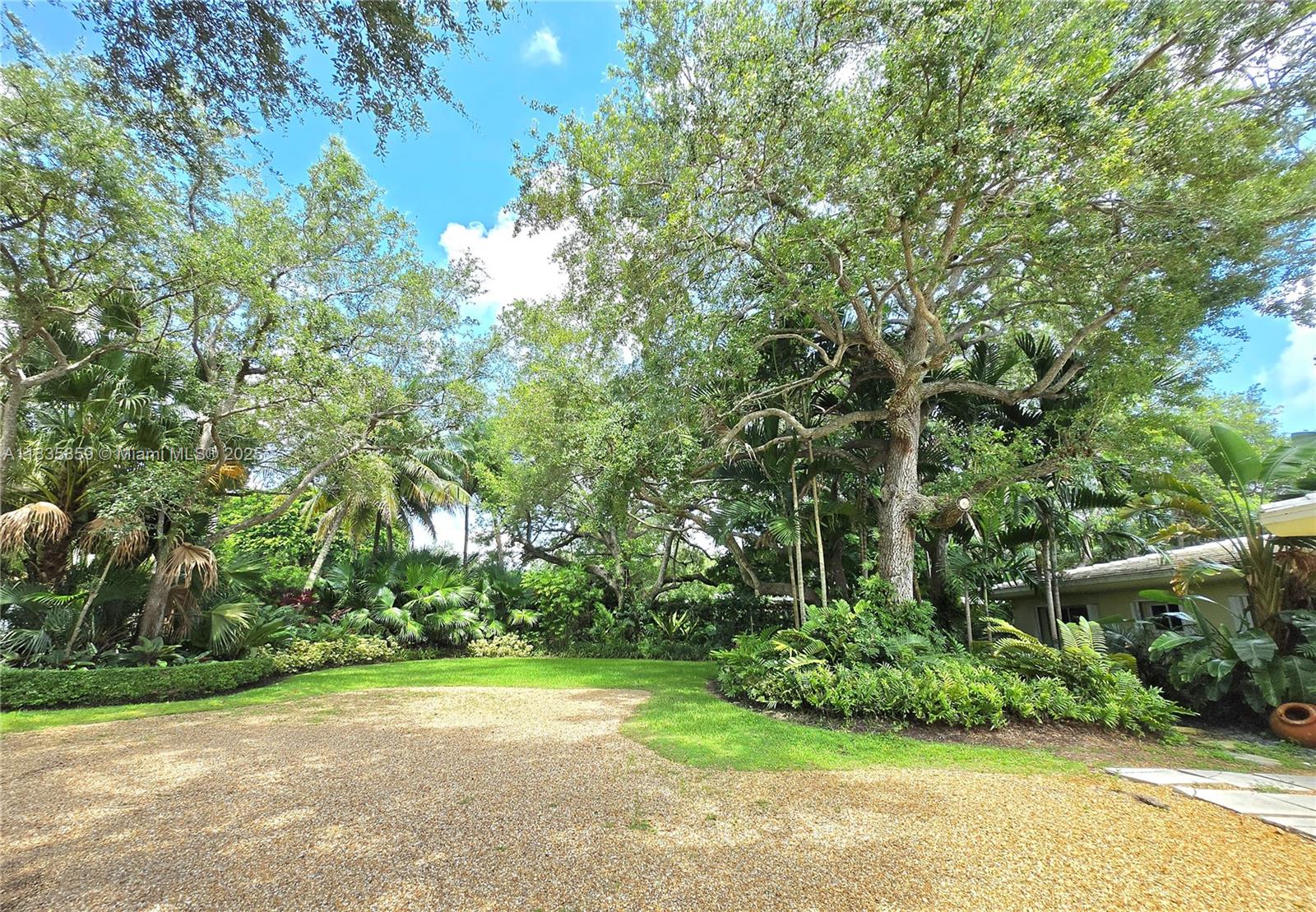 7895 Southwest 122nd Street Pinecrest, FL 33156 - Photo 4 of 78 a view of a yard with a tree