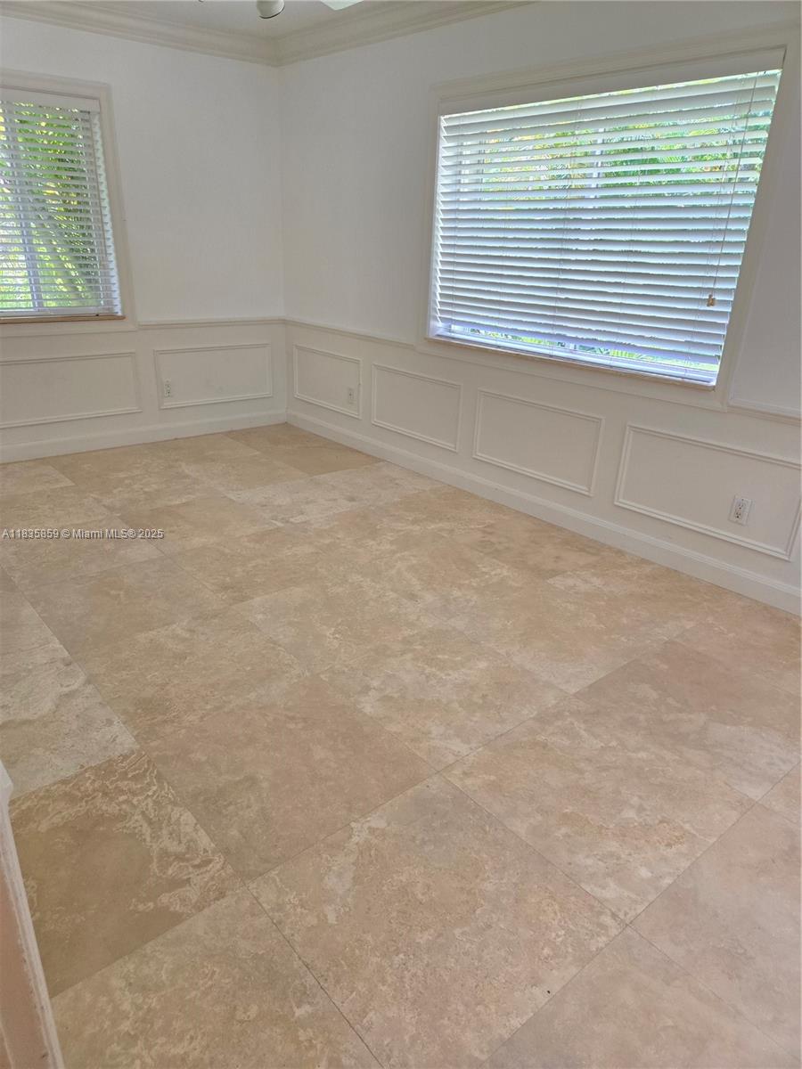 7895 Southwest 122nd Street Pinecrest, FL 33156 - Photo 45 of 78 a view of an empty room with a window