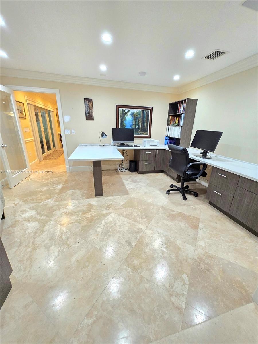 7895 Southwest 122nd Street Pinecrest, FL 33156 - Photo 56 of 78 a living room with furniture and a flat screen tv