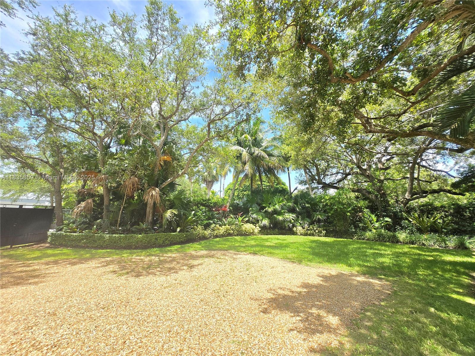7895 Southwest 122nd Street Pinecrest, FL 33156 - Photo 64 of 78 a view of outdoor space with garden