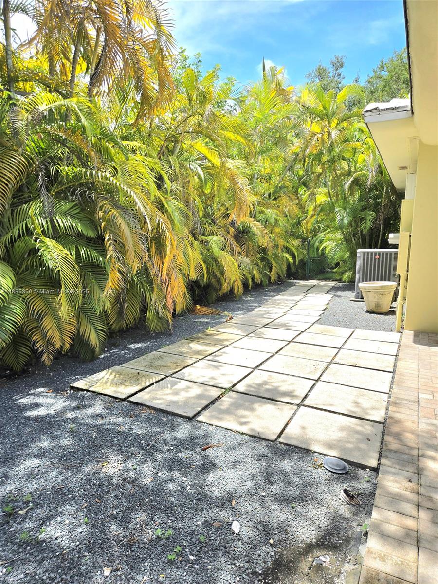 7895 Southwest 122nd Street Pinecrest, FL 33156 - Photo 67 of 78 a view of backyard with wooden fence