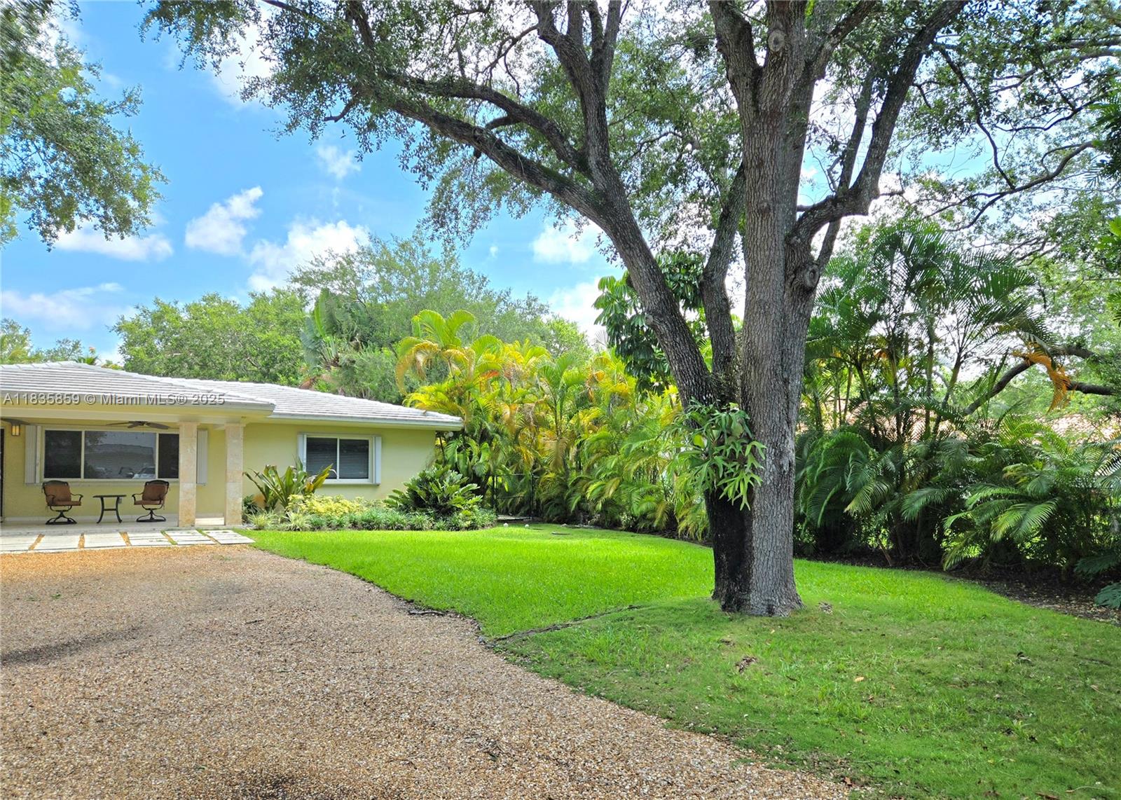 7895 Southwest 122nd Street Pinecrest, FL 33156 - Photo 72 of 78 a front view of house with yard and green space