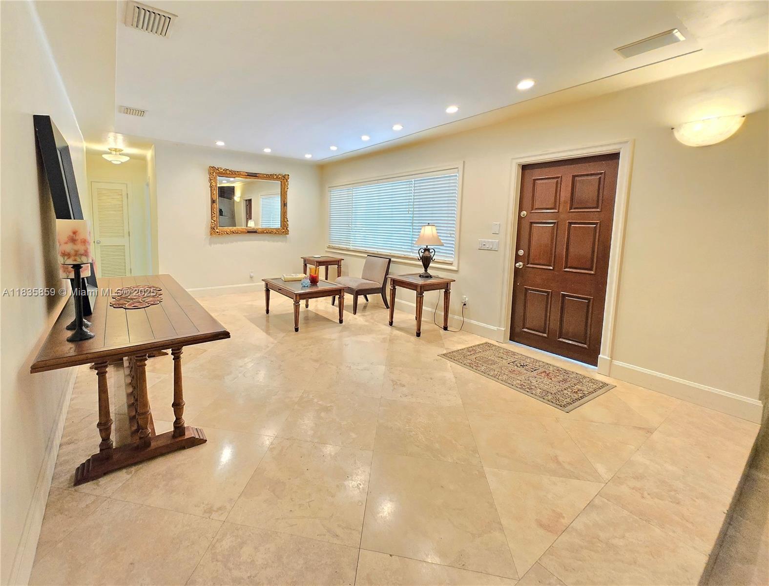 7895 Southwest 122nd Street Pinecrest, FL 33156 - Photo 8 of 78 a view of a livingroom with furniture and workspace
