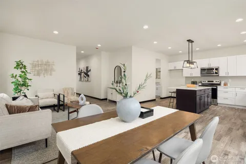 a dining room with furniture and window