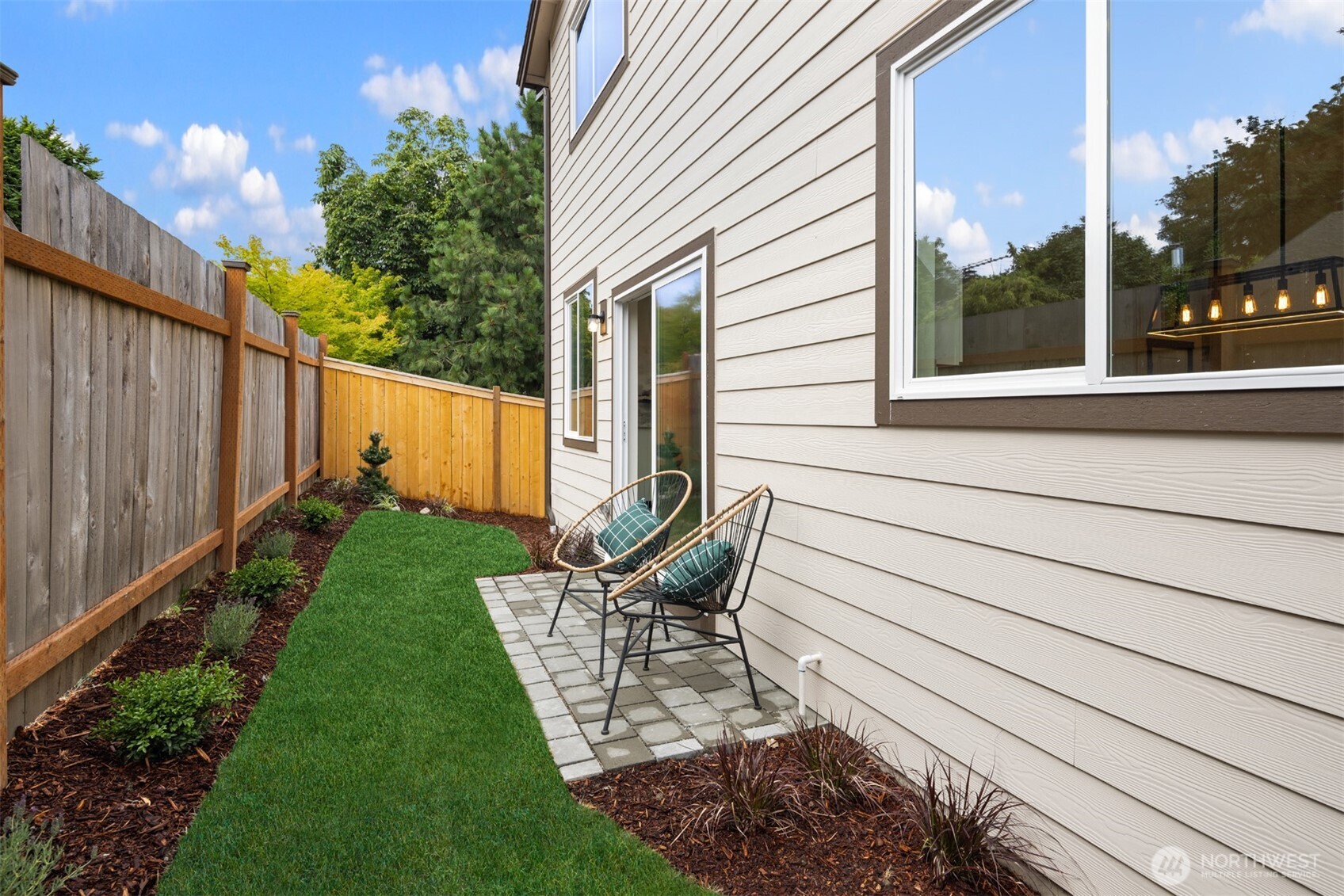 9245 Kelsey Lane Southwest Seattle, WA 98106 - Photo 17 of 33 a view of a chair and tables in the backyard
