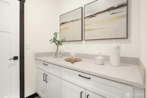 a bedroom with a bed and a chair