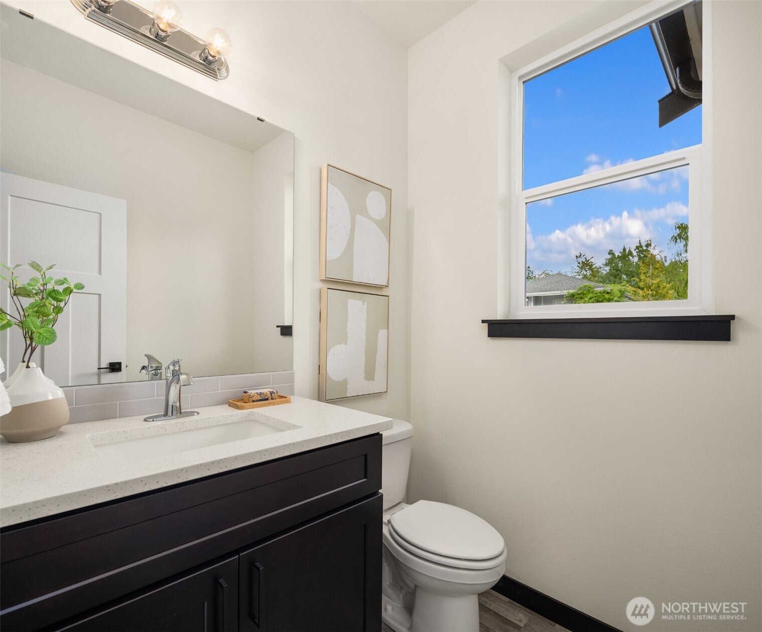9245 Kelsey Lane Southwest Seattle, WA 98106 - Photo 19 of 33 a bathroom with a sink a toilet and mirror