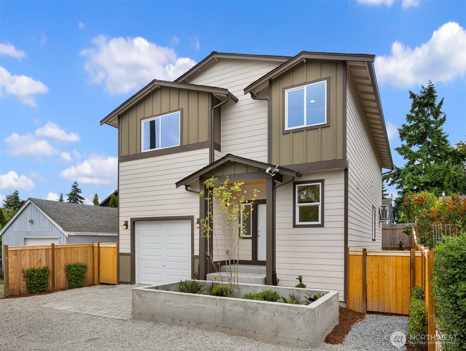 9245 Kelsey Lane Southwest Seattle, WA 98106 - Photo 2 of 33 a front view of a house with garden