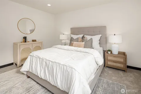 a bathroom with a double vanity sink toilet and shower
