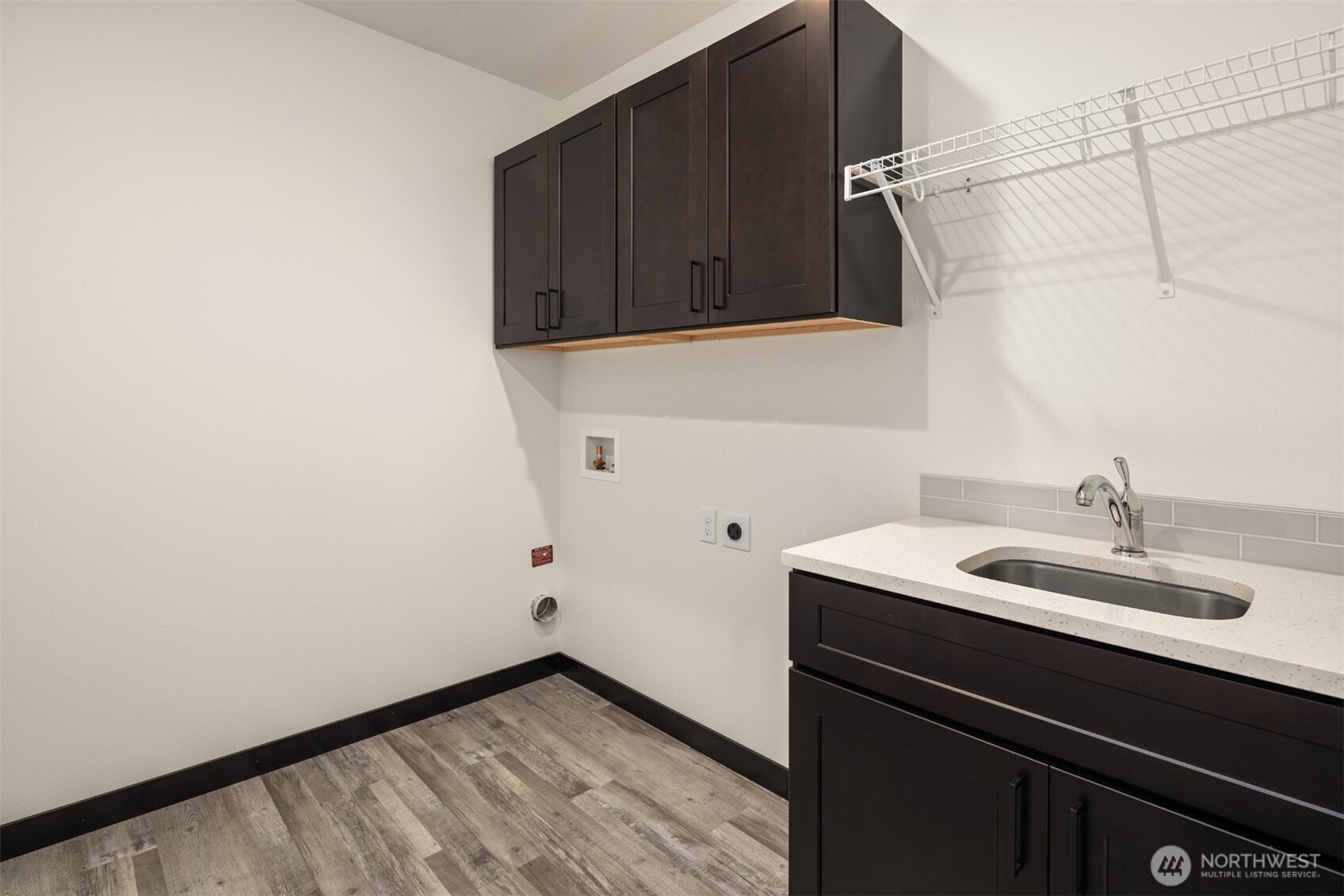 9245 Kelsey Lane Southwest Seattle, WA 98106 - Photo 31 of 33 a bathroom with a sink and a mirror