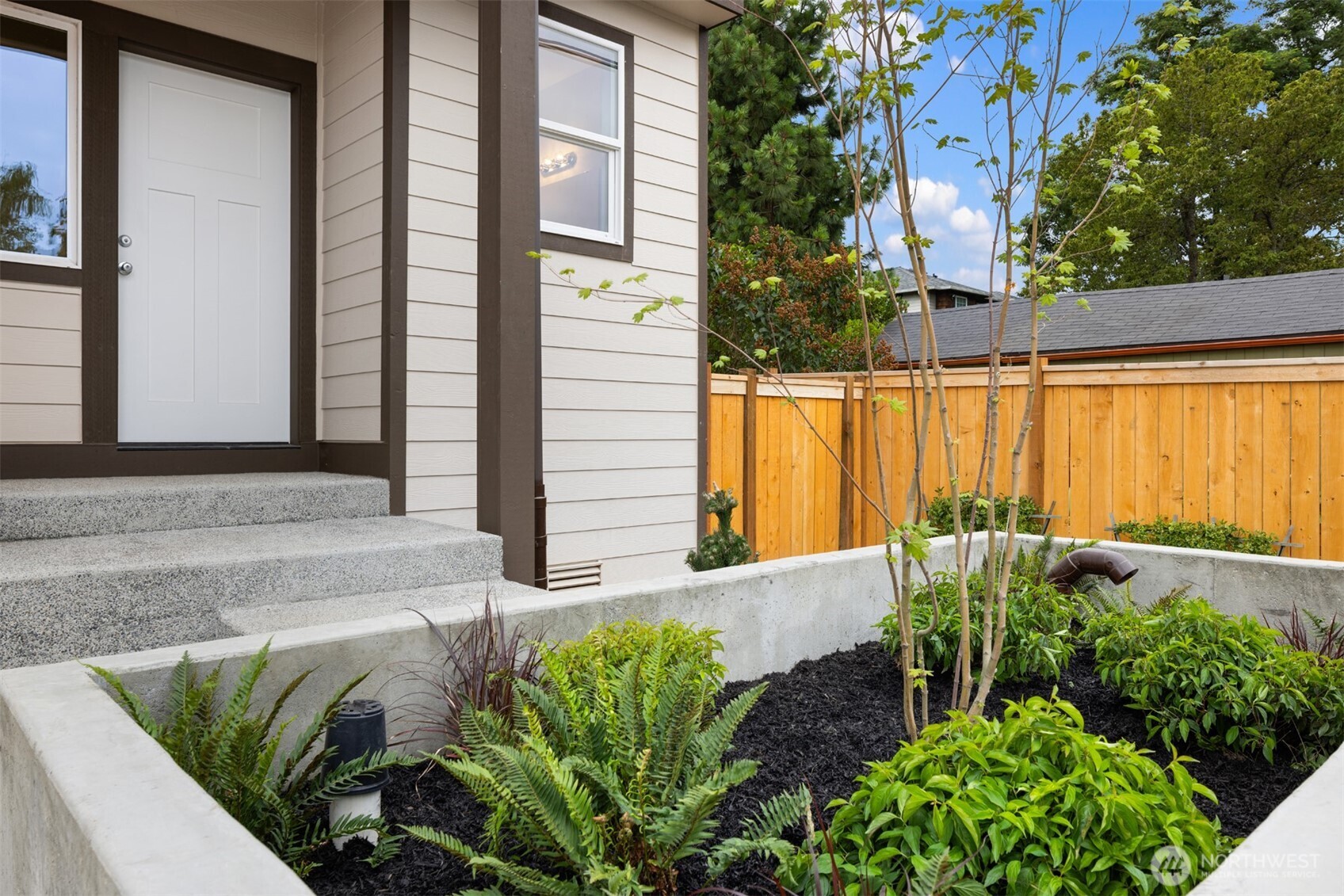 9245 Kelsey Lane Southwest Seattle, WA 98106 - Photo 33 of 33 a front view of a house with garden