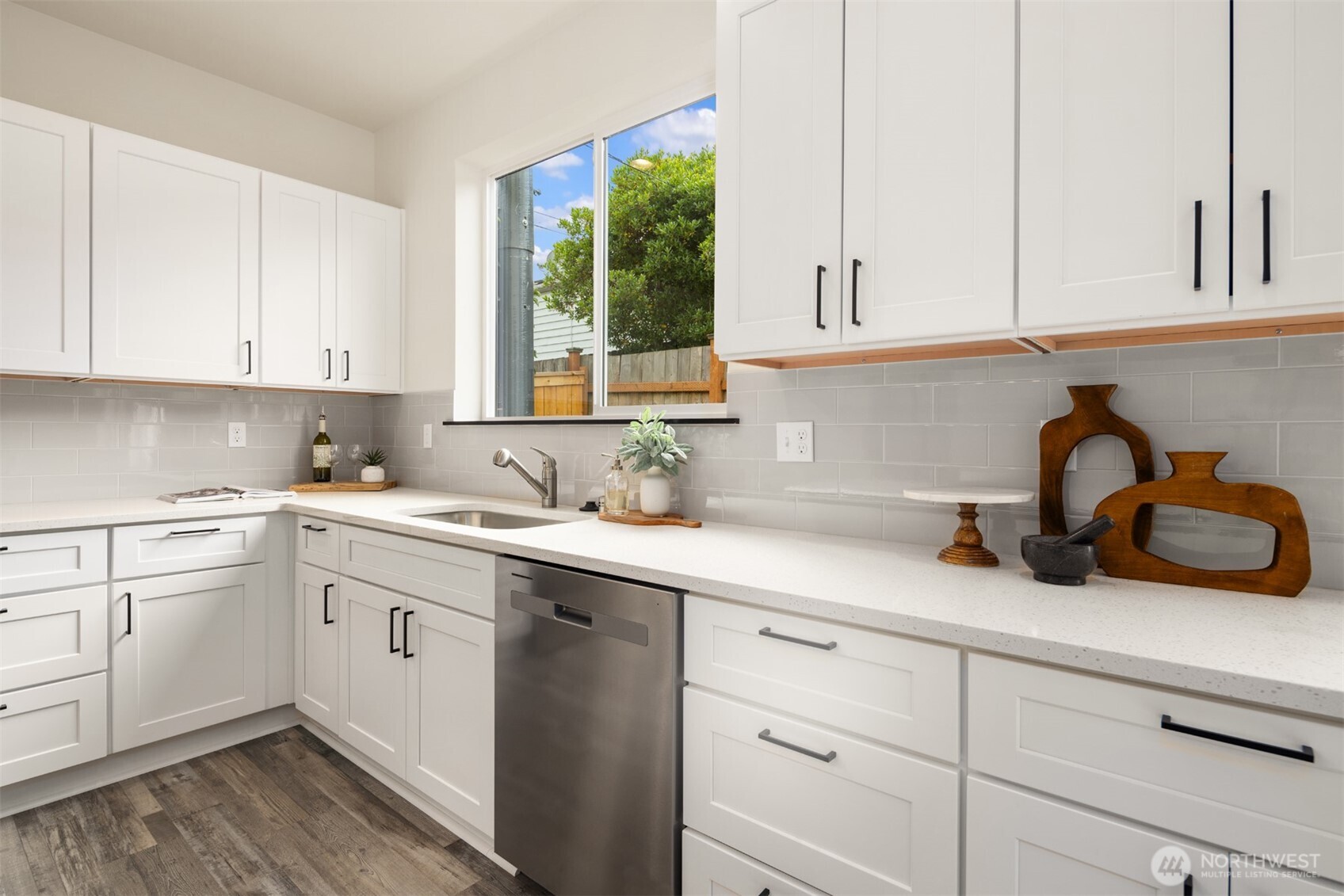 9245 Kelsey Lane Southwest Seattle, WA 98106 - Photo 8 of 33 a kitchen with cabinets appliances a sink and a window