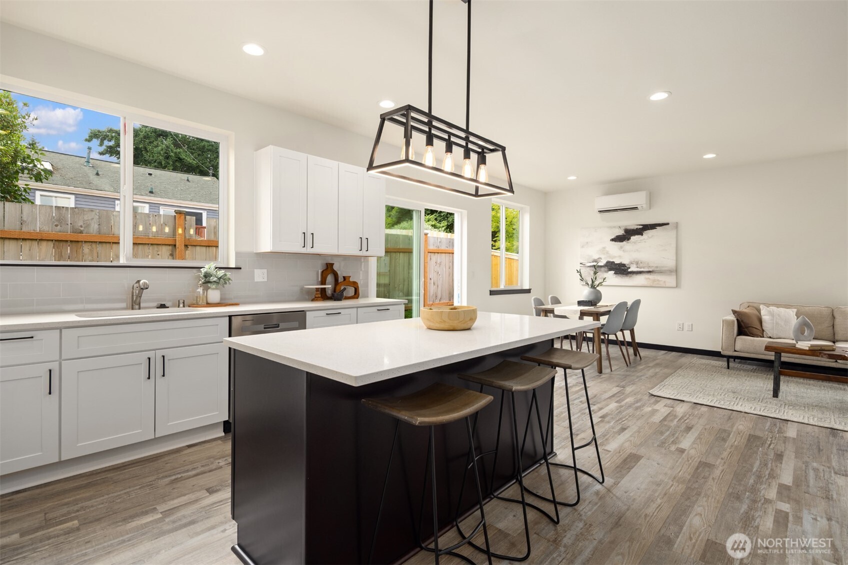 9245 Kelsey Lane Southwest Seattle, WA 98106 - Photo 10 of 33 a kitchen with a sink a counter top space and living room view