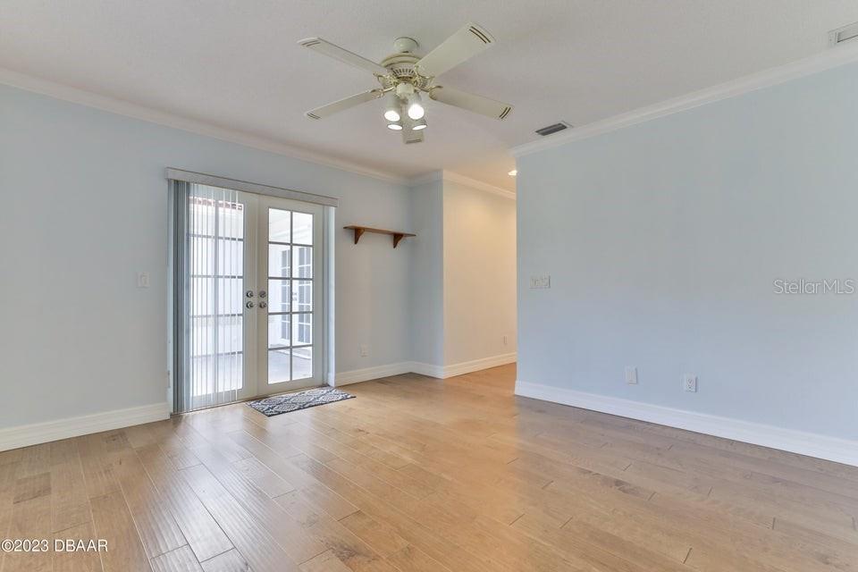 4895 Sailfish Drive Ponce Inlet, FL 32127 - Photo 12 of 34 wooden floor in an empty room with a window