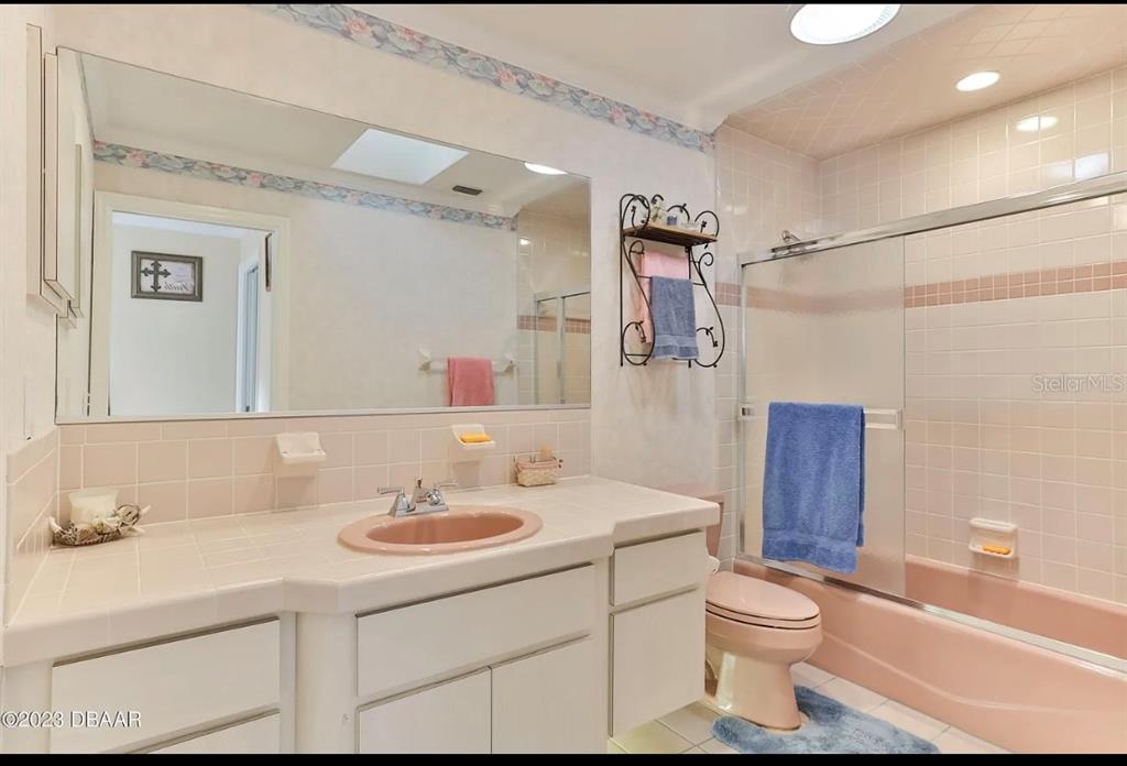 4895 Sailfish Drive Ponce Inlet, FL 32127 - Photo 21 of 34 a bathroom with a sink toilet vanity and shower