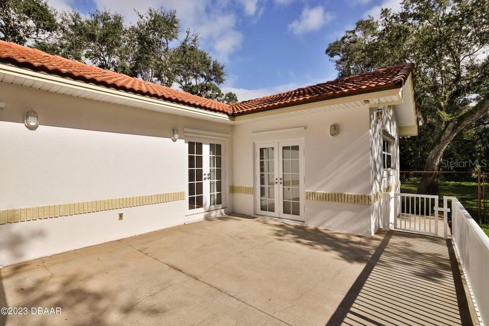 4895 Sailfish Drive Ponce Inlet, FL 32127 - Photo 22 of 34 a view of a house with a wooden floor