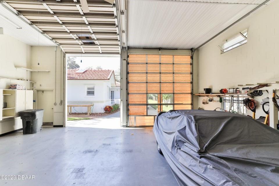 4895 Sailfish Drive Ponce Inlet, FL 32127 - Photo 27 of 34 a living room with furniture and a large window