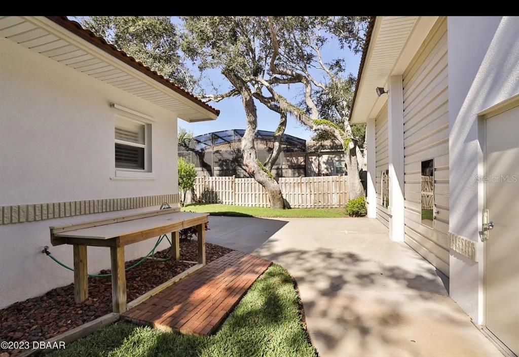 4895 Sailfish Drive Ponce Inlet, FL 32127 - Photo 29 of 34 a view of a house with backyard and sitting area