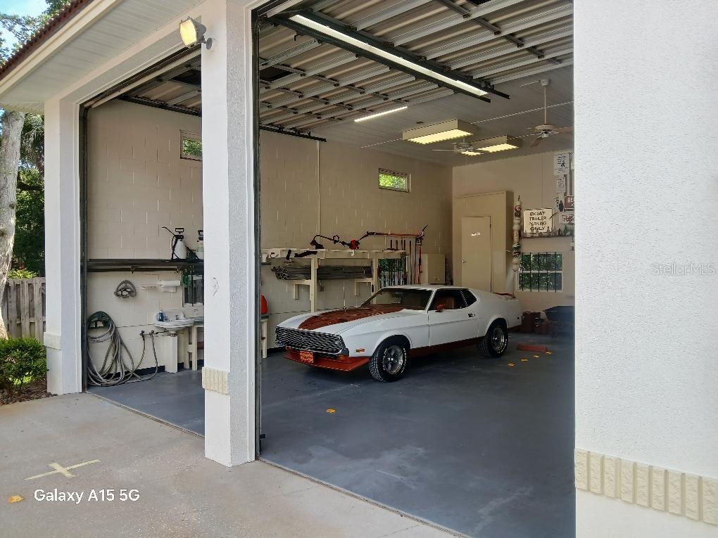 4895 Sailfish Drive Ponce Inlet, FL 32127 - Photo 32 of 34 a car parked in parking area of a building