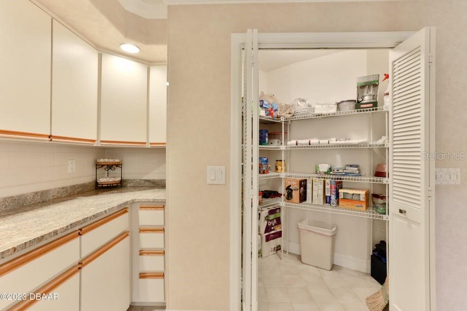 4895 Sailfish Drive Ponce Inlet, FL 32127 - Photo 4 of 34 a view of kitchen with cabinets and window