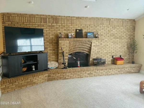 a view of a livingroom with a fireplace