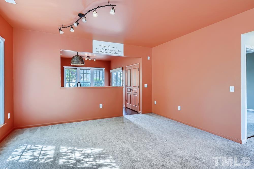 564 Tomkins Loop Cary, NC 27519 - Photo 14 of 28 a view of an empty room with a window