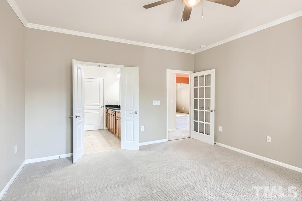 564 Tomkins Loop Cary, NC 27519 - Photo 17 of 28 an empty room with closet and windows