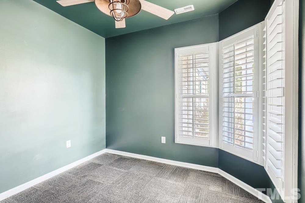 564 Tomkins Loop Cary, NC 27519 - Photo 20 of 28 a view of an empty room with a window