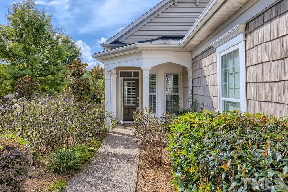 564 Tomkins Loop Cary, NC 27519 - Photo 3 of 28 a front view of a house with garden
