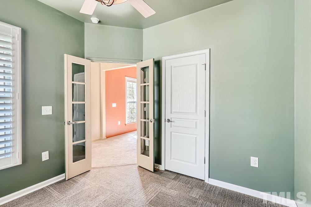 564 Tomkins Loop Cary, NC 27519 - Photo 21 of 28 an empty room with entrance and windows