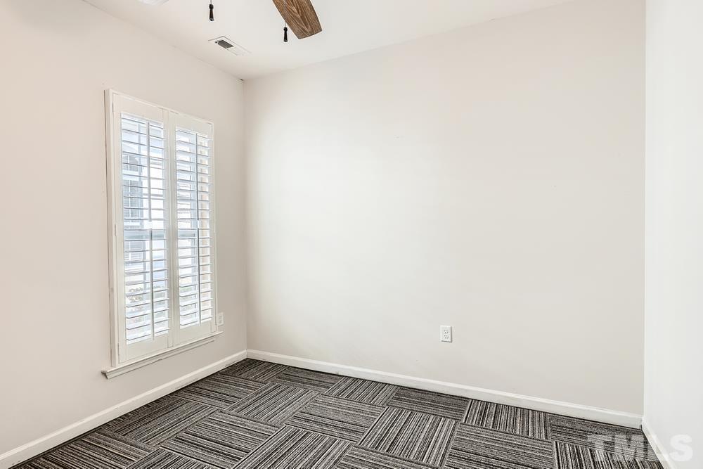 564 Tomkins Loop Cary, NC 27519 - Photo 22 of 28 a view of an empty room with a window