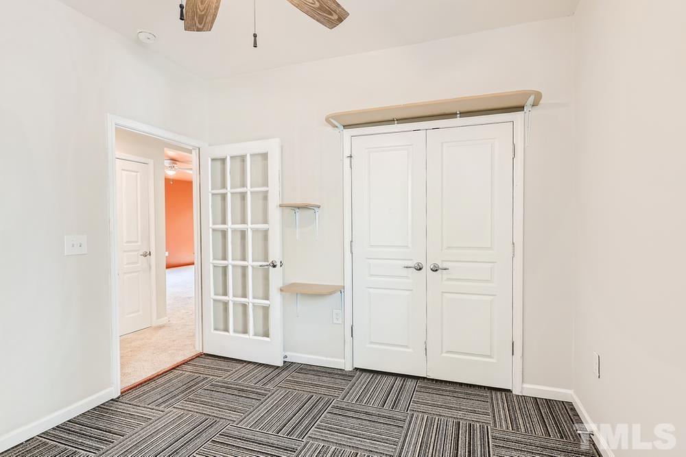564 Tomkins Loop Cary, NC 27519 - Photo 23 of 28 a view of wooden floor and windows in a room