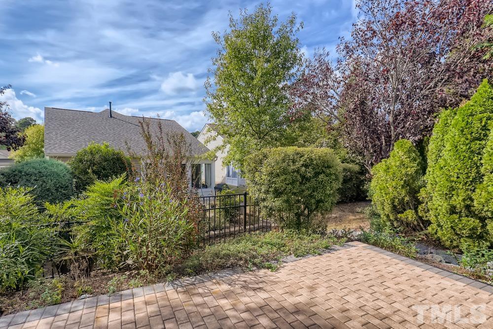 564 Tomkins Loop Cary, NC 27519 - Photo 27 of 28 a backyard of a house with lots of green space