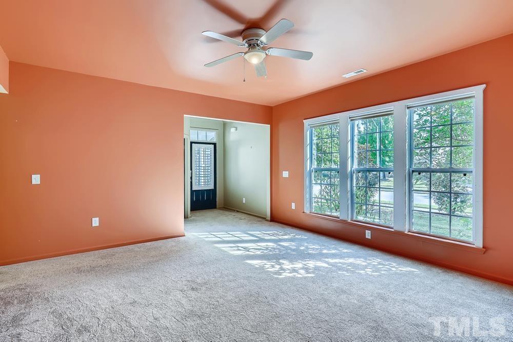 564 Tomkins Loop Cary, NC 27519 - Photo 6 of 28 a view of a livingroom with a ceiling fan and window