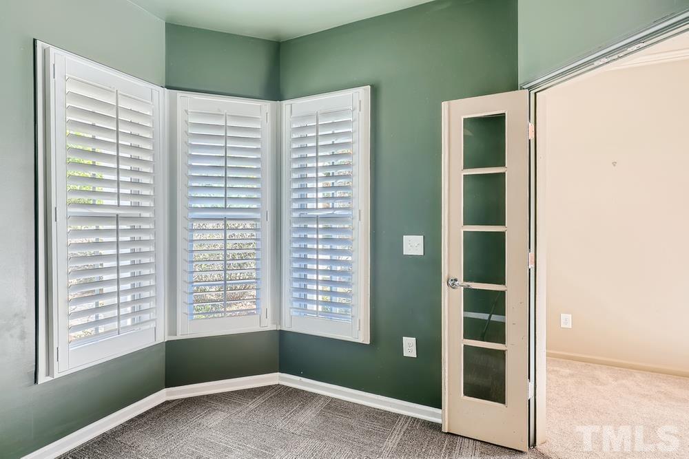 564 Tomkins Loop Cary, NC 27519 - Photo 7 of 28 an empty room with windows and entrance