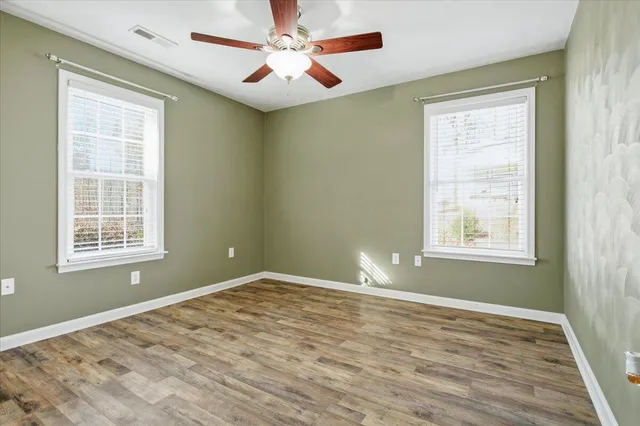 a view of a big yard with a house and a big yard and large trees