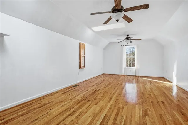 a backyard of a house with plants and tree