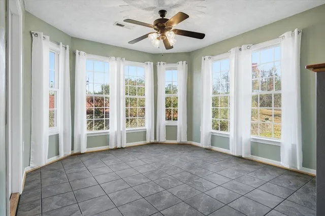 a kitchen with white cabinets appliances and sink