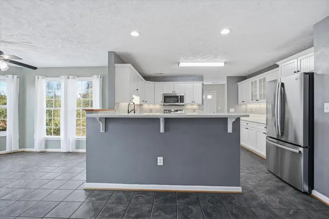 a utility room with closet dryer and washer
