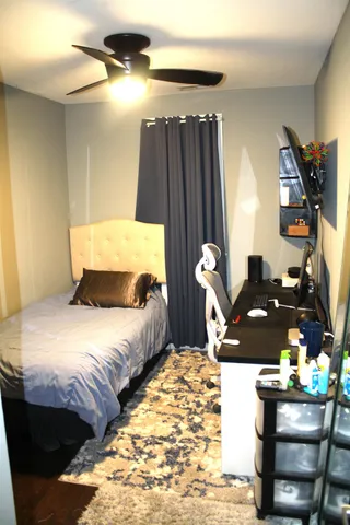 a bedroom with bed and window