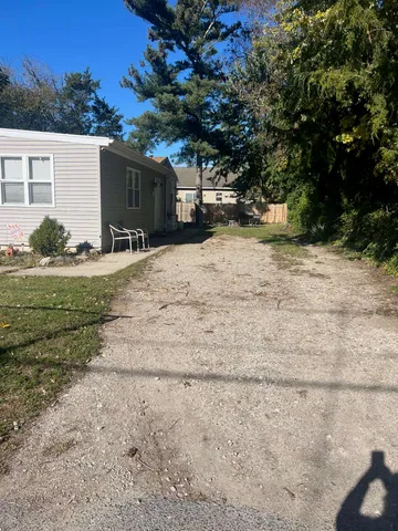 a view of a backyard of the house