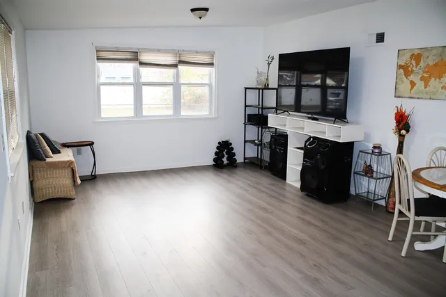 a room with furniture and a flat screen tv