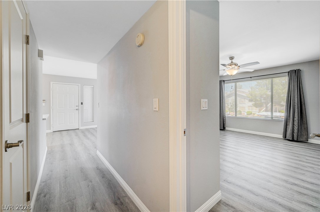 3425 East Russell Road, Unit 223 Las Vegas, NV 89120 - Photo 27 of 47 A welcoming entryway with fresh flooring transitions seamlessly into a well-lit living area.