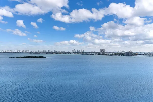 a spacious bathroom with a bathtub and a sink
