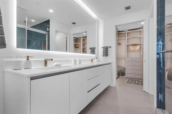 a bedroom with a bed and a closet